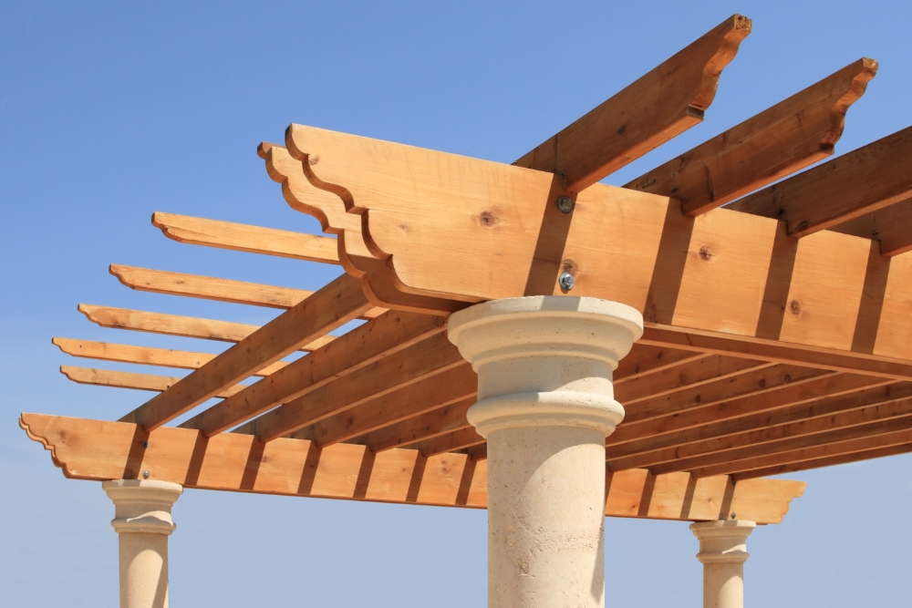 enhancing outdoor spaces with wooden pergolas