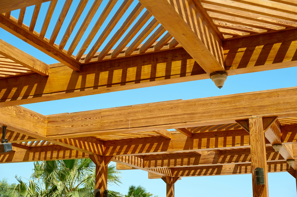 Garden Harmony: Coordinating Your Pergola with Outdoor Furniture and Greenery part,of,the,wooden,roof,structure,on,the,gazebo,on